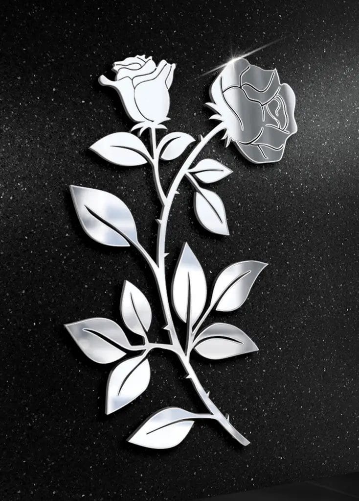 Stalowy ornament różany na tle nagrobka